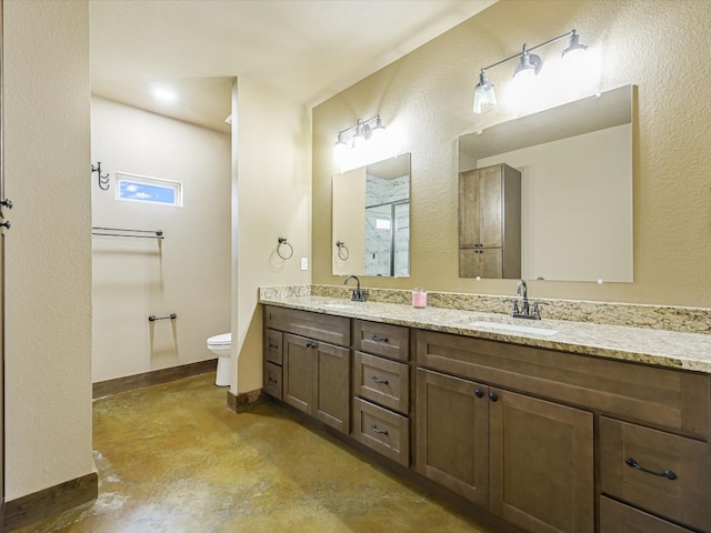 bathroom featuring concrete flooring, toilet, and double sink vanity