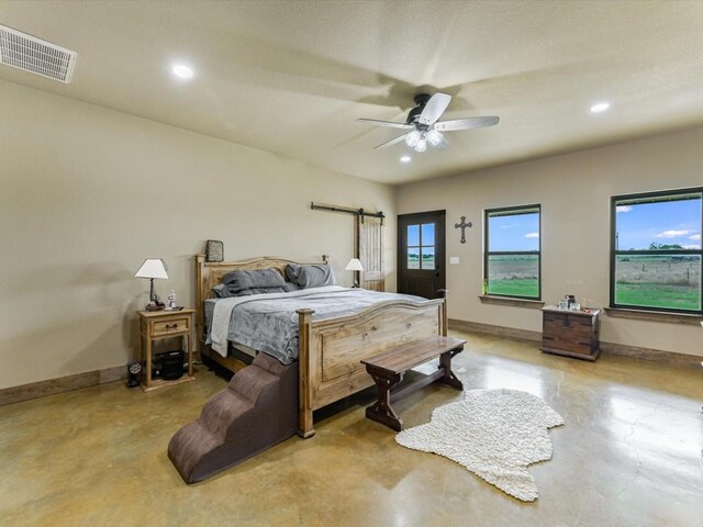 bedroom with concrete floors and ceiling fan