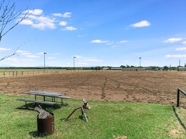 view of property's community featuring a lawn