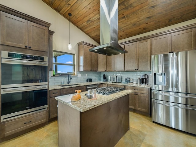 kitchen with stainless steel appliances, island range hood, sink, pendant lighting, and decorative backsplash