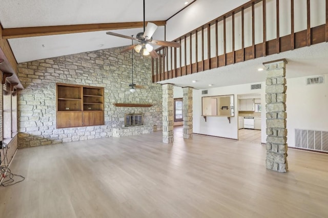 unfurnished living room with wood finished floors, a ceiling fan, visible vents, decorative columns, and beamed ceiling