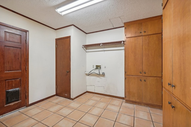 interior space with light tile patterned flooring and a textured ceiling