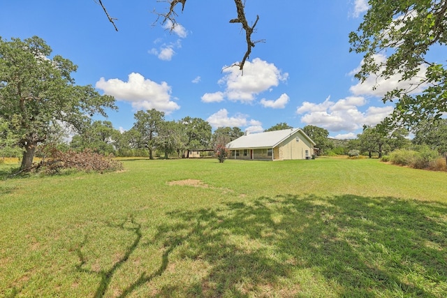 view of yard with a rural view