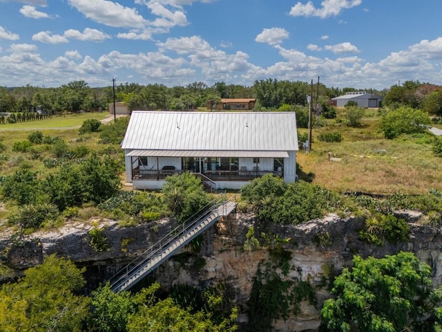 25633 Pedernales Point Dr, Spicewood, TX 78669 - rear view of property featuring a metal roof and stairs