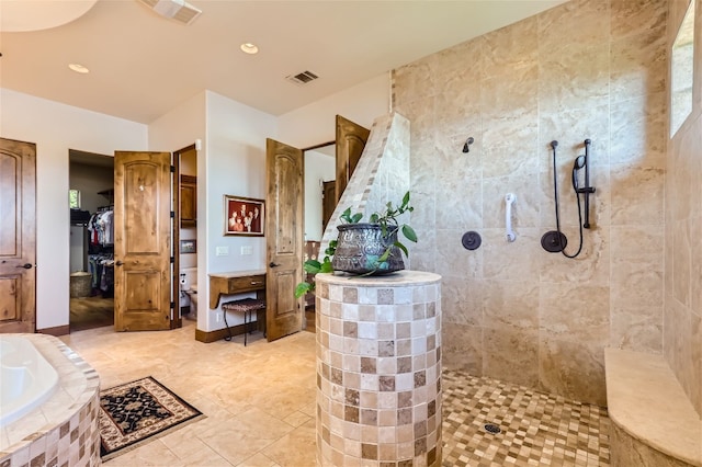 bathroom featuring plus walk in shower and tile patterned flooring