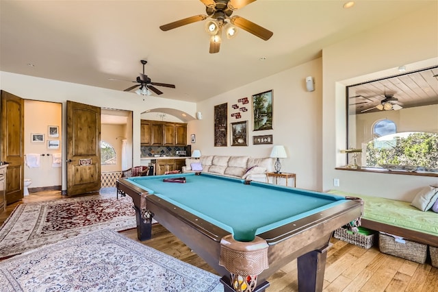 rec room featuring light hardwood / wood-style flooring, pool table, and ceiling fan