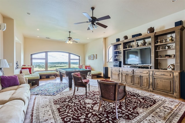 living room featuring hardwood / wood-style floors, billiards, and ceiling fan