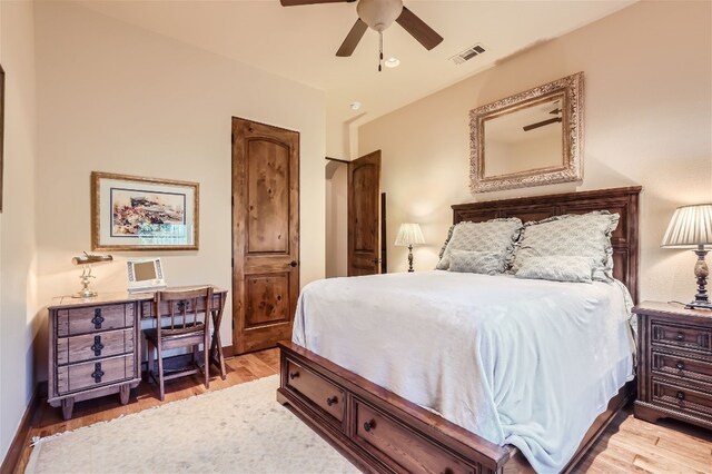 bedroom with ceiling fan and light wood-type flooring