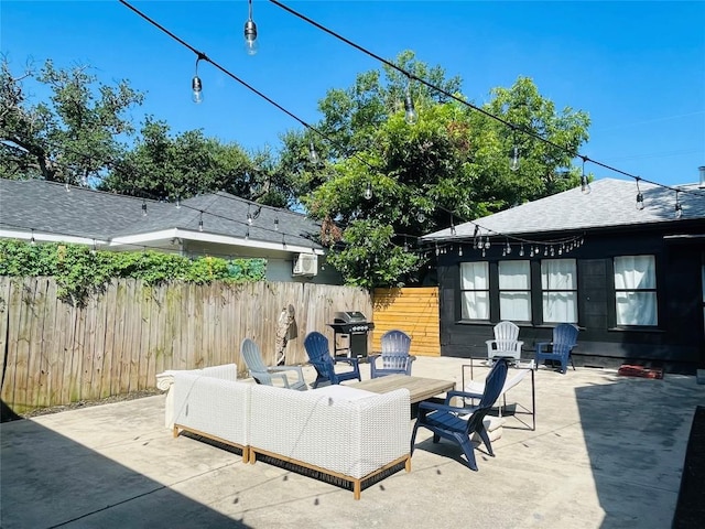 view of patio / terrace with area for grilling and a fire pit