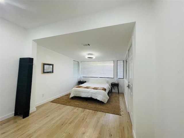 bedroom with light hardwood / wood-style floors