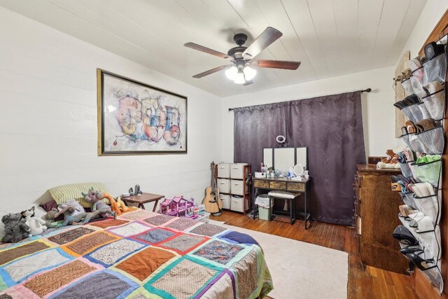 bedroom featuring ceiling fan and hardwood / wood-style floors