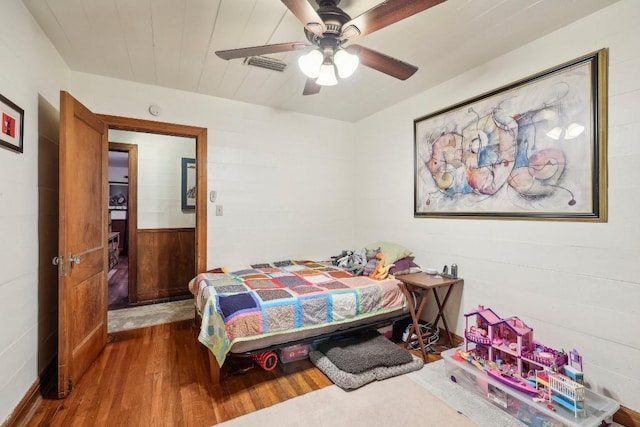 bedroom with hardwood / wood-style flooring and ceiling fan