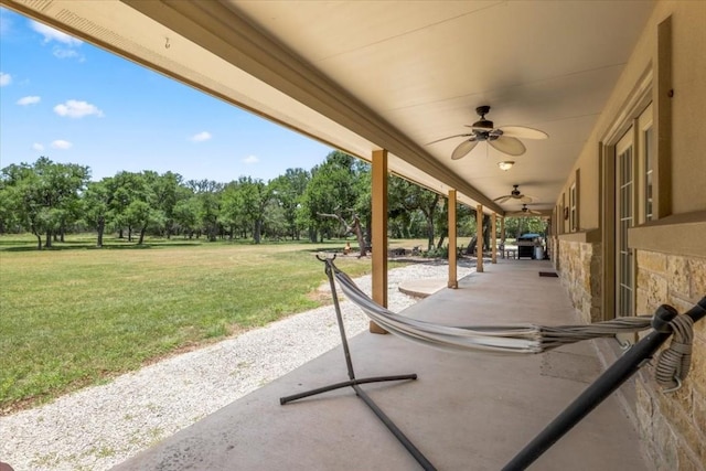 view of patio / terrace featuring ceiling fan