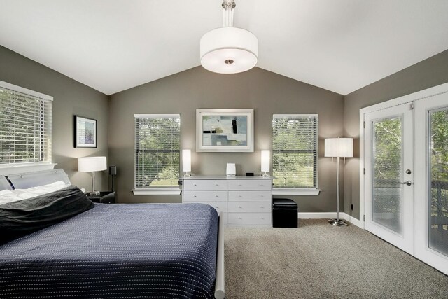 carpeted bedroom with multiple windows, access to outside, french doors, and lofted ceiling