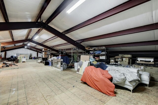 interior space featuring vaulted ceiling with beams