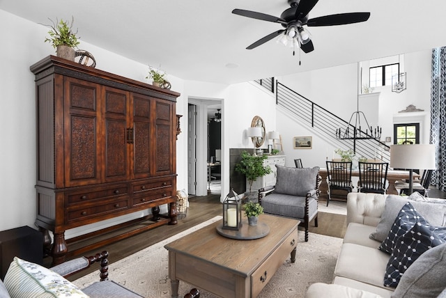 living room with ceiling fan and hardwood / wood-style floors