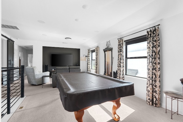 rec room featuring billiards, a barn door, and light colored carpet