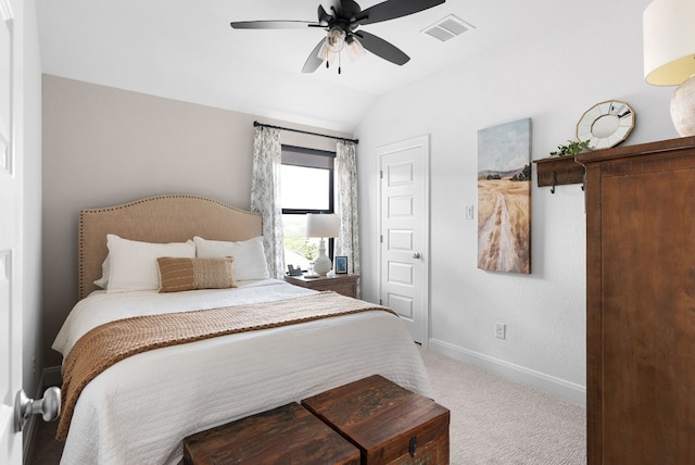 carpeted bedroom featuring lofted ceiling and ceiling fan