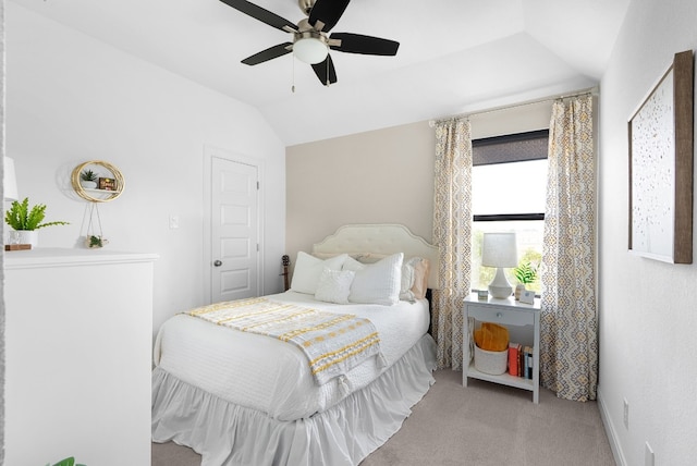 bedroom featuring lofted ceiling, light colored carpet, and ceiling fan