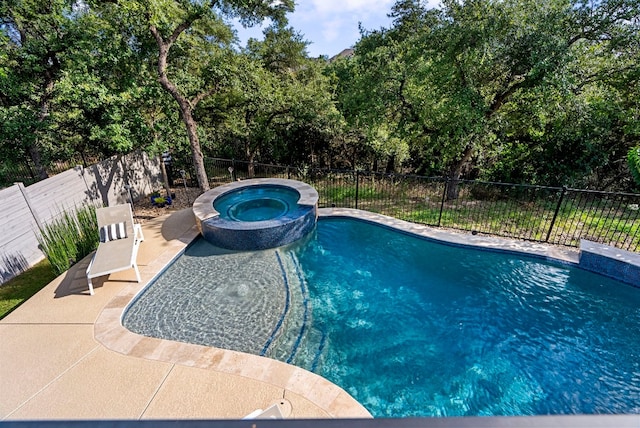 view of pool featuring an in ground hot tub and a patio area