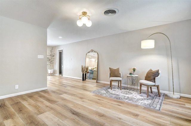 sitting room with light wood-type flooring