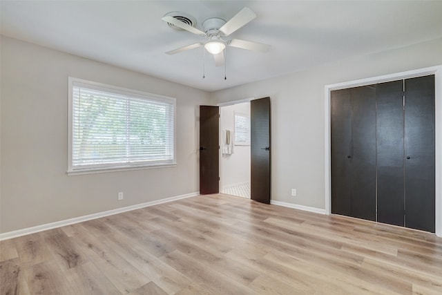 unfurnished bedroom with ceiling fan and light hardwood / wood-style flooring