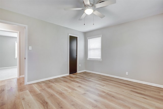 spare room with ceiling fan and light hardwood / wood-style flooring