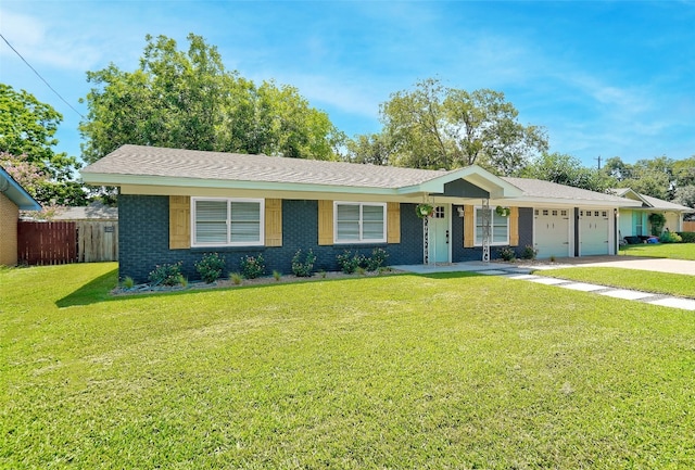 ranch-style house with a front yard and a garage