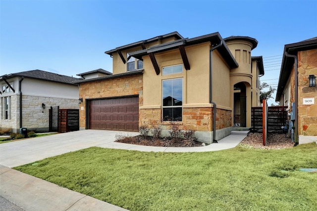 view of front of property with a garage and a front lawn