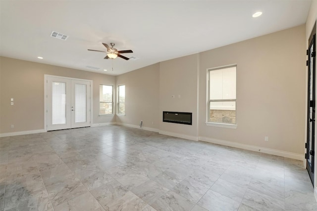 unfurnished living room featuring french doors, light tile patterned floors, and ceiling fan