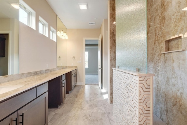 bathroom featuring vanity, tile patterned flooring, and plenty of natural light