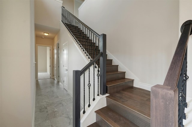 stairs with tile patterned flooring