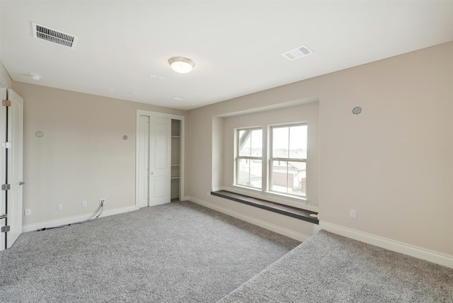 unfurnished room with carpet floors