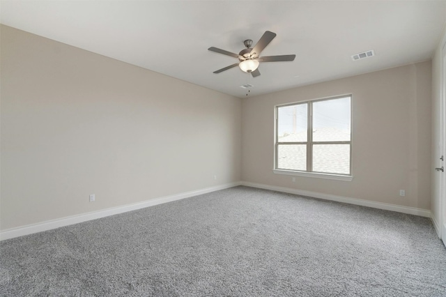 carpeted empty room featuring ceiling fan