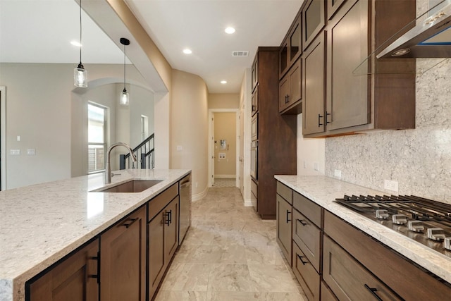 kitchen with light tile patterned flooring, ventilation hood, decorative backsplash, pendant lighting, and sink