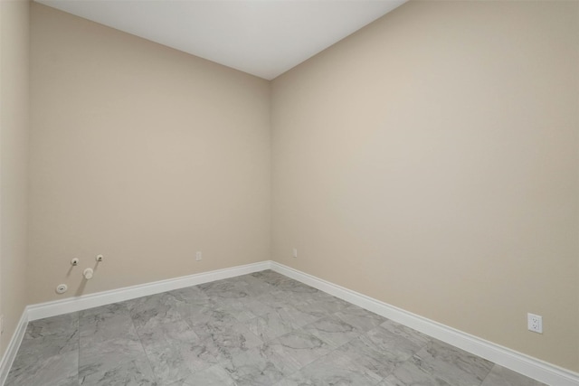 spare room featuring light tile patterned flooring