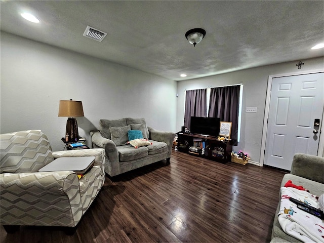 living room with dark hardwood / wood-style flooring