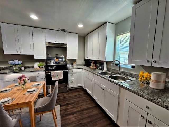 kitchen featuring stainless steel range with electric stovetop, under cabinet range hood, a sink, dark wood finished floors, and white cabinetry