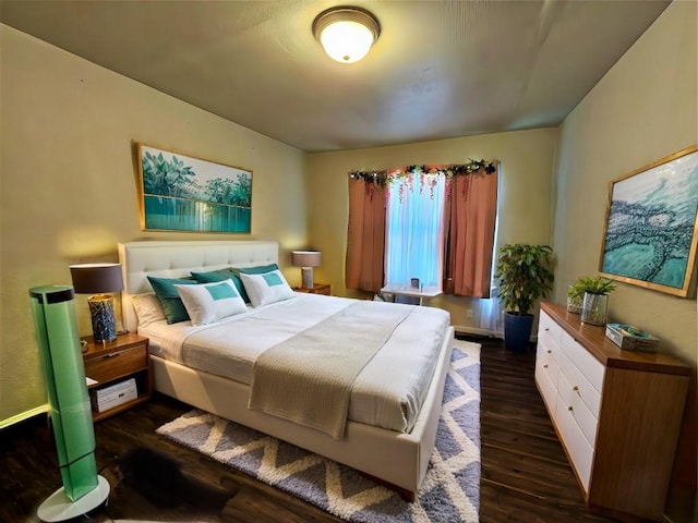 bedroom featuring dark wood-style floors