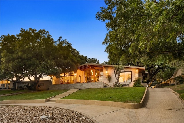 view of front of home featuring a yard