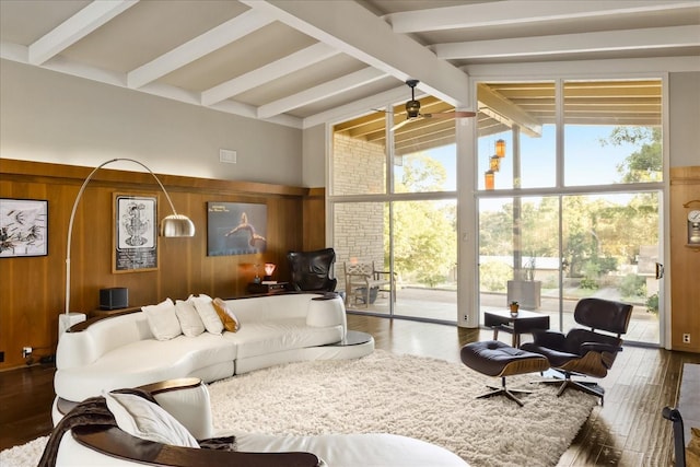 interior space featuring vaulted ceiling with beams, wood-type flooring, and wood walls