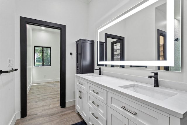 bathroom with vanity and hardwood / wood-style flooring