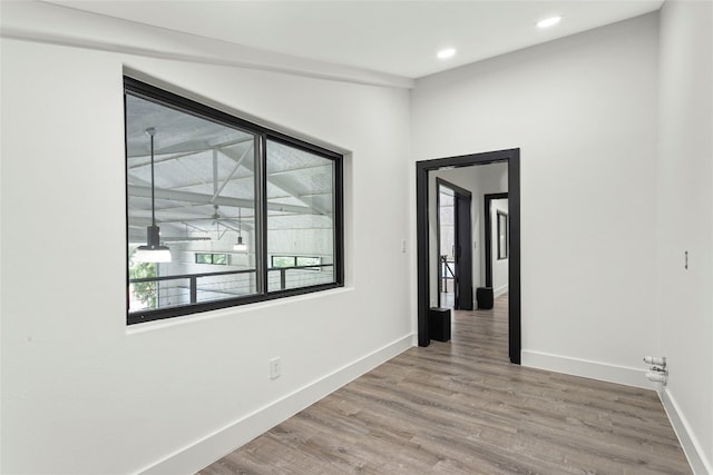 empty room with wood-type flooring