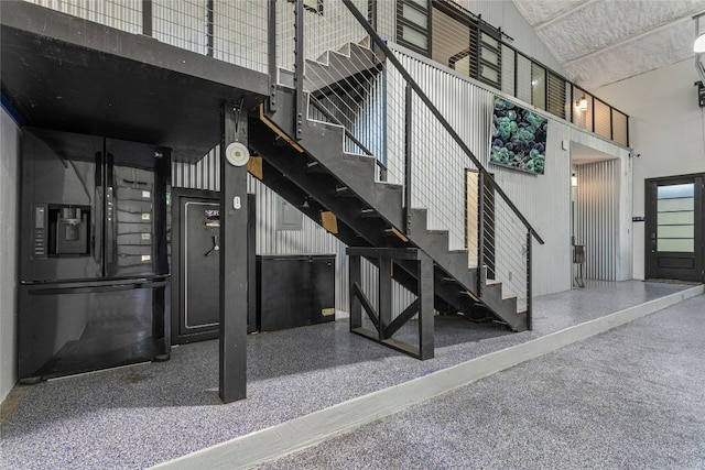5110 Sioux Ln, Austin, TX 78734 - staircase with a high ceiling and speckle patterned floor