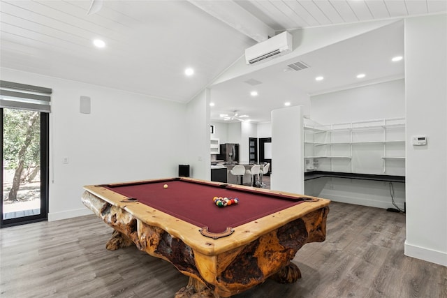 rec room with a wall mounted air conditioner, vaulted ceiling with beams, light hardwood / wood-style flooring, and pool table