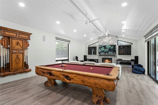 rec room featuring light wood-type flooring, wood ceiling, a large fireplace, lofted ceiling with beams, and pool table