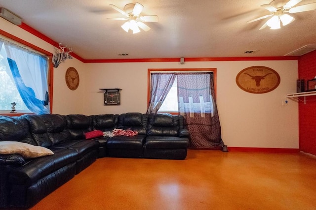 living room with ceiling fan and a textured ceiling