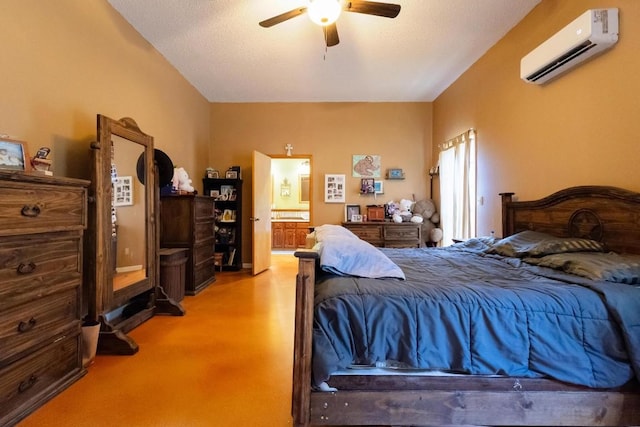 carpeted bedroom featuring a textured ceiling, ensuite bath, a wall unit AC, and ceiling fan