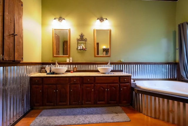 bathroom featuring a tub and vanity