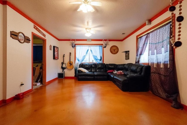 living room with ceiling fan, crown molding, and a textured ceiling